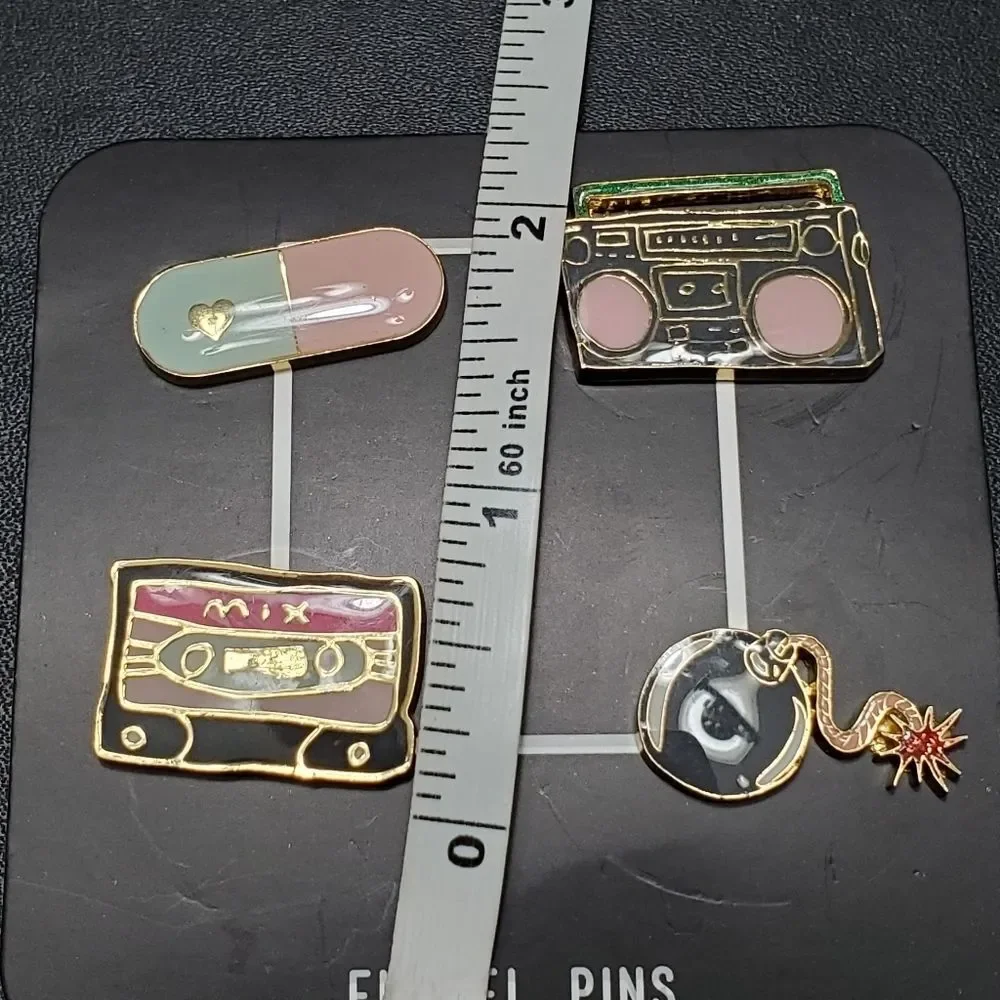 Gold tone set of 4 enamel pins